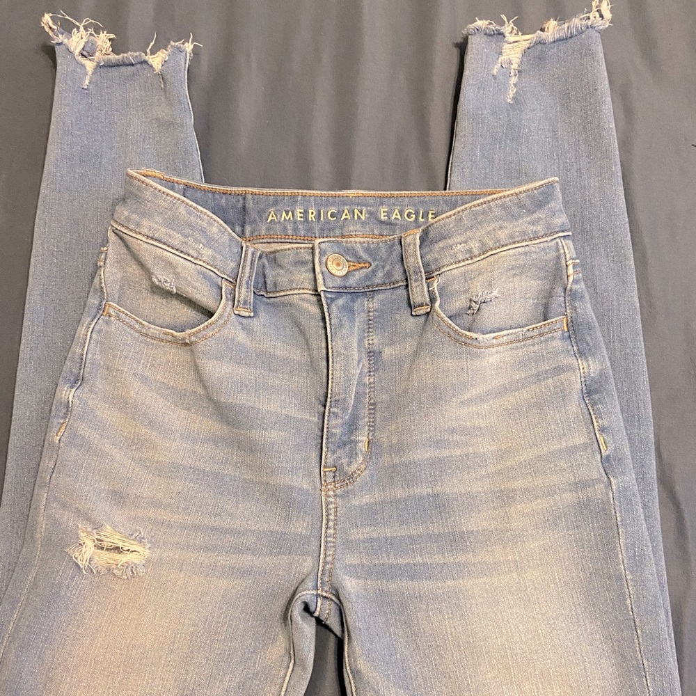American Eagle The Dream Jean in size 0 Regular. Light wash with rips.